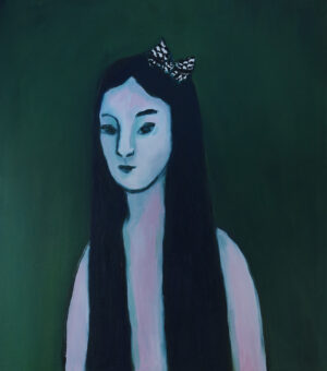 Palestiinalainen tummahiuksinen tyttö katsoo kohti.